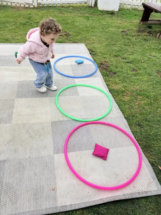 Outdoor movement play with colourful hoops