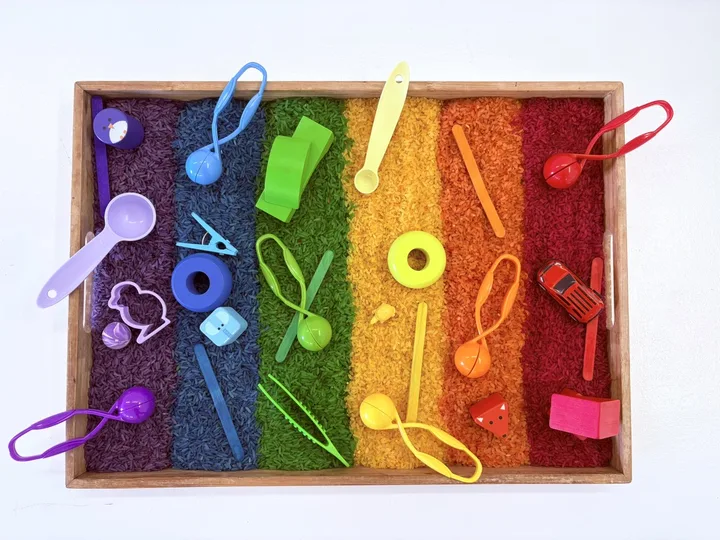A colourful prepared sensory tray